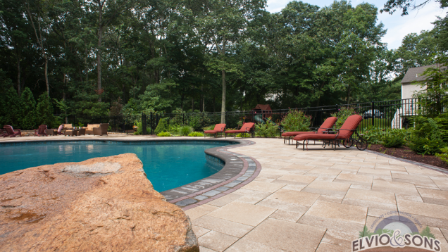 A custom diving rock by in-ground gunite pool.