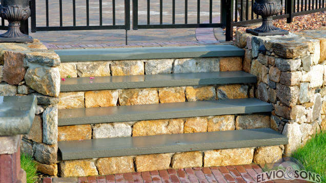 Custom natural stone steps with bluestone caps.
