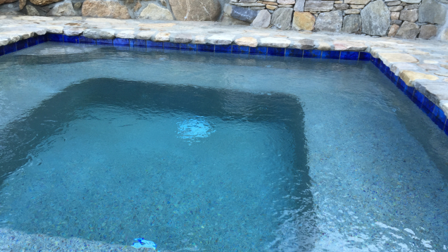 Custom in-ground gunite spa.