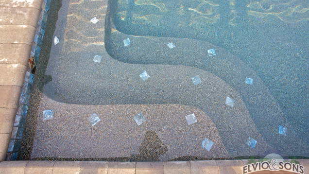 Gunite pool steps with depth assisting tile.