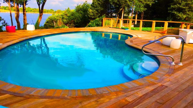 In-ground gunite pool restoration completed with new pool deck.