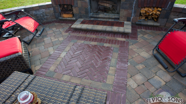 Paver and brick patio with built-in fireplace.